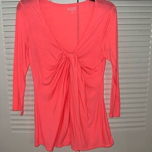 Very bright pinkish orange long sleeved  t-shirt with faux knot in front.